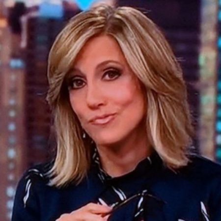 Alisyn Camerota in a black shirt poses for a picture.